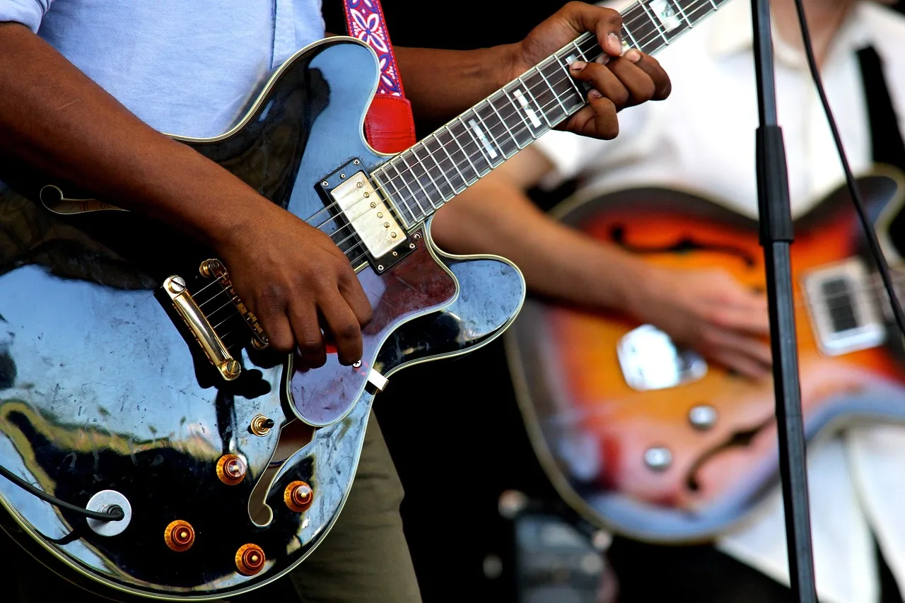 Guitarists playing together on stage Guitarists playing together on stage