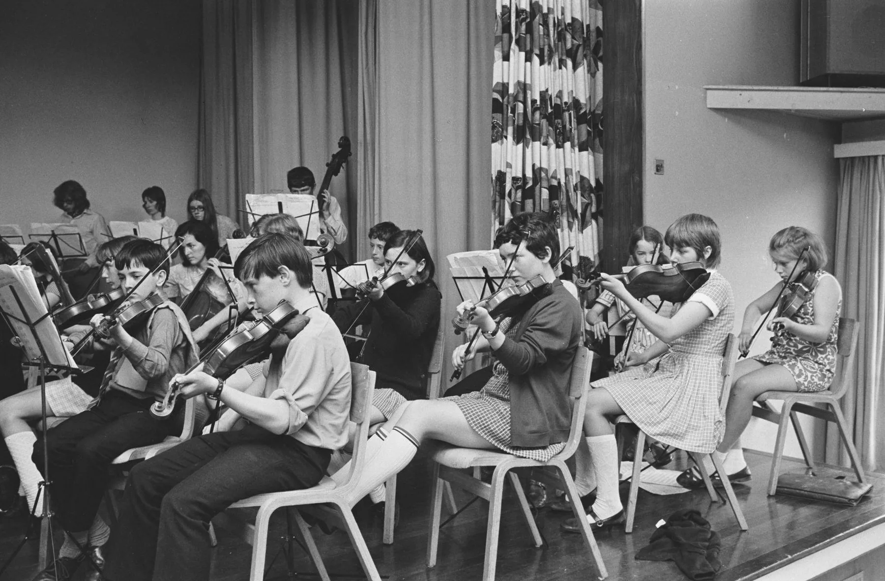 Young orchestra rehearsing with its violins Young orchestra rehearsing with its violins