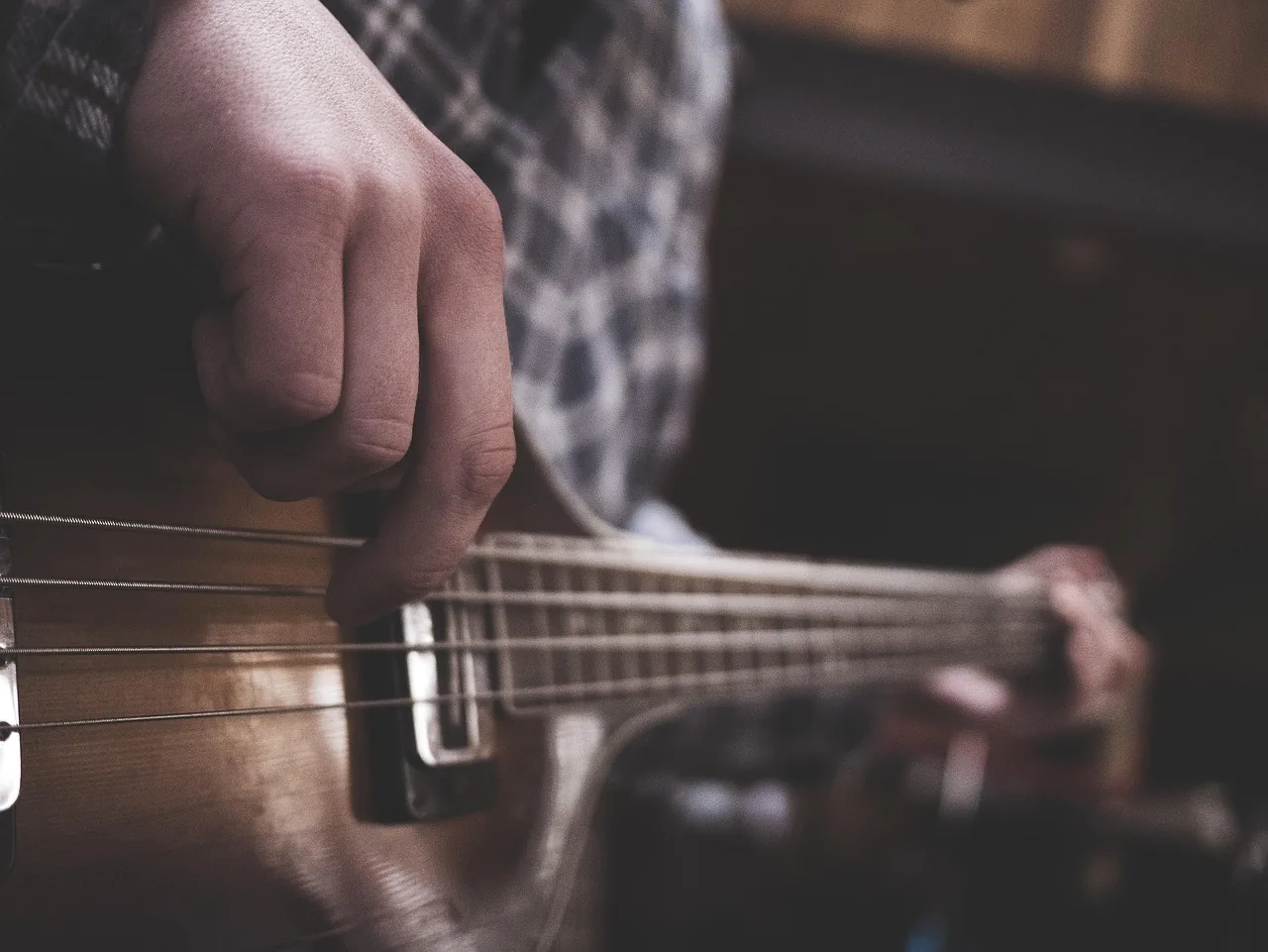 Musician playing an acoustic guitar