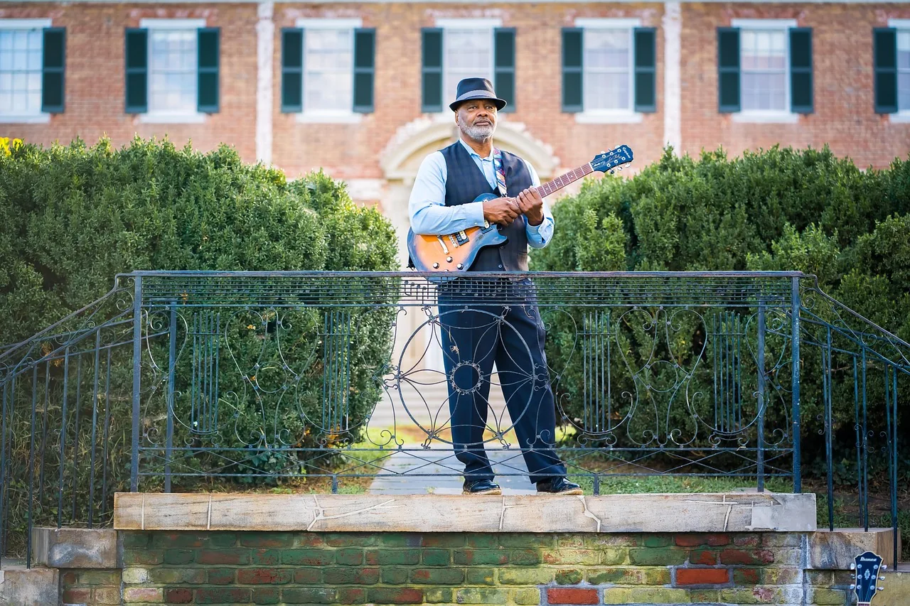 Guitarist during an outdoor performance Guitarist during an outdoor performance