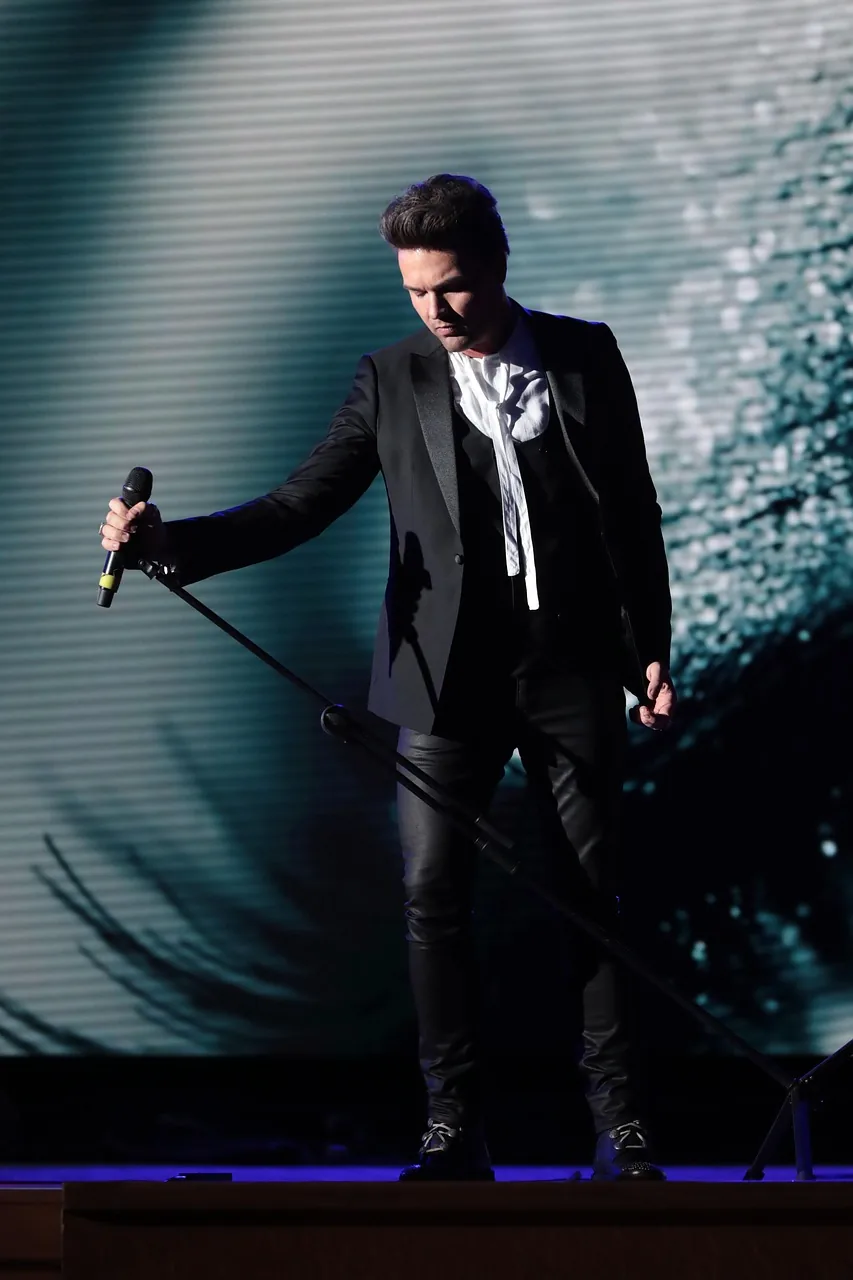 Singer performing on stage Singer performing on stage