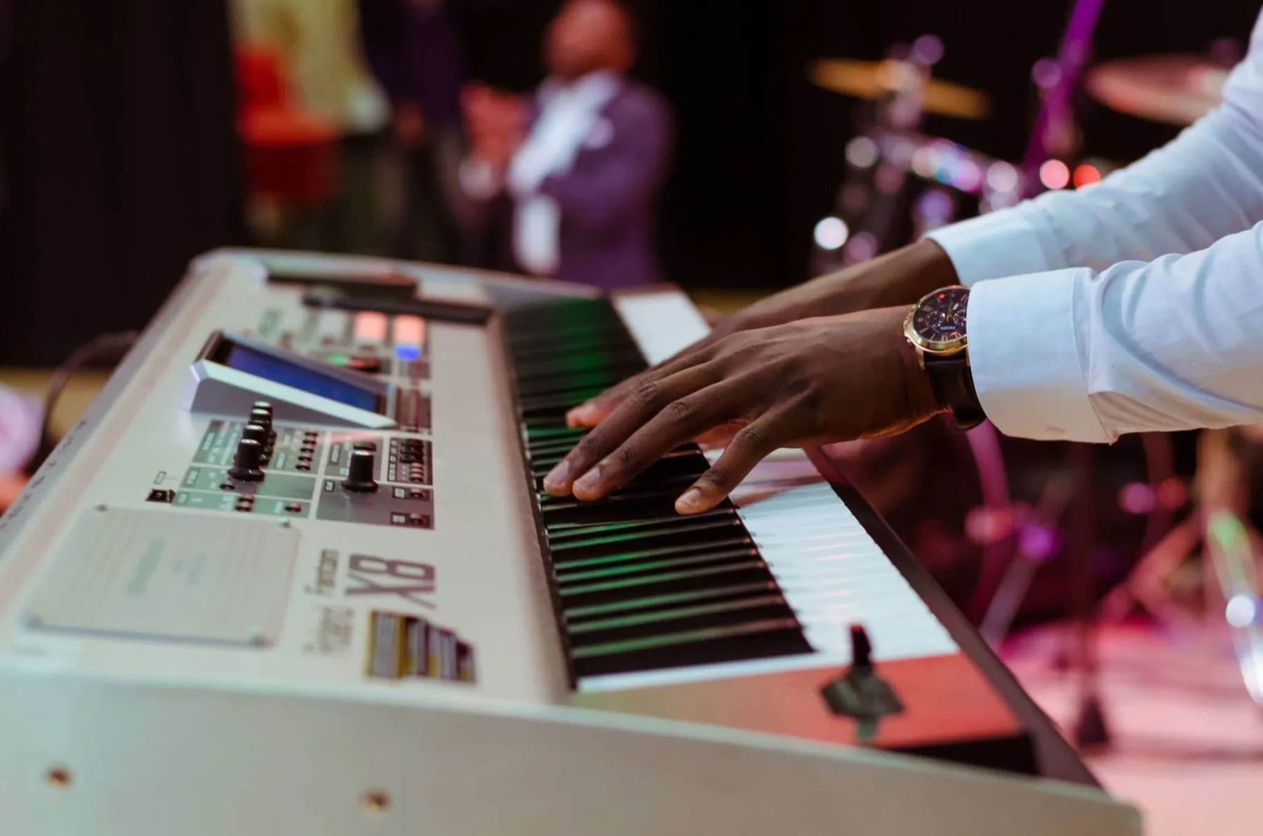 Musician playing the keyboard on stage
