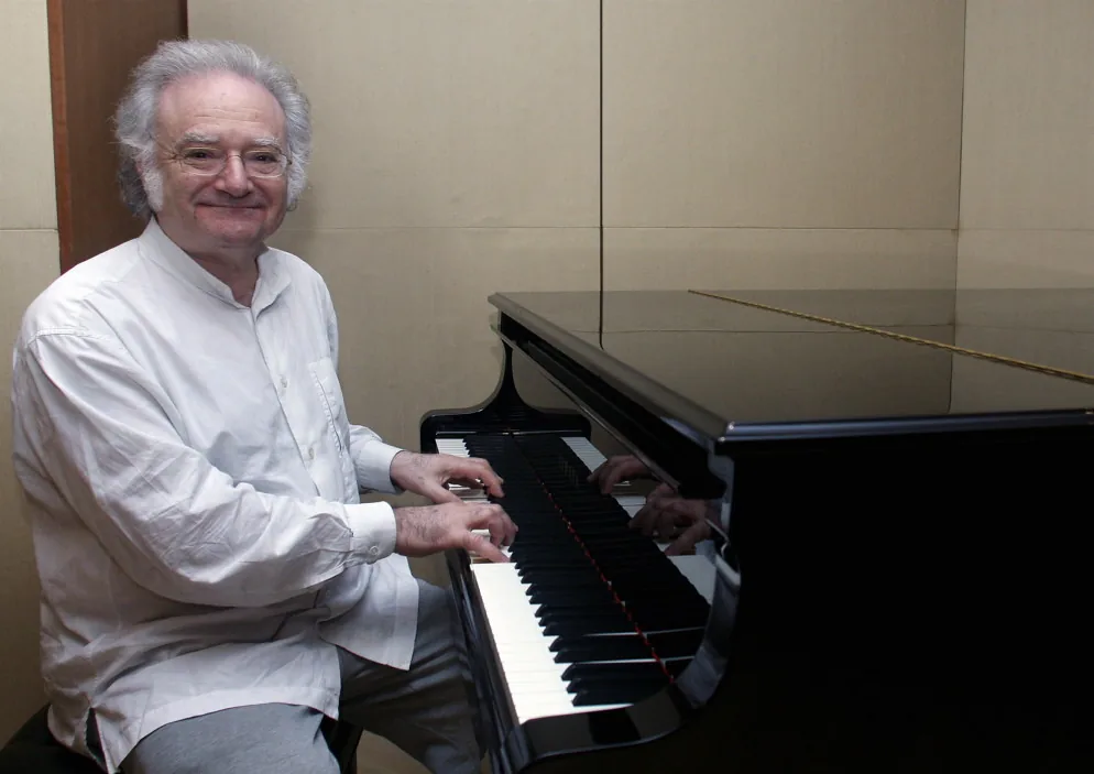 Pianist playing a grand piano Pianist playing a grand piano