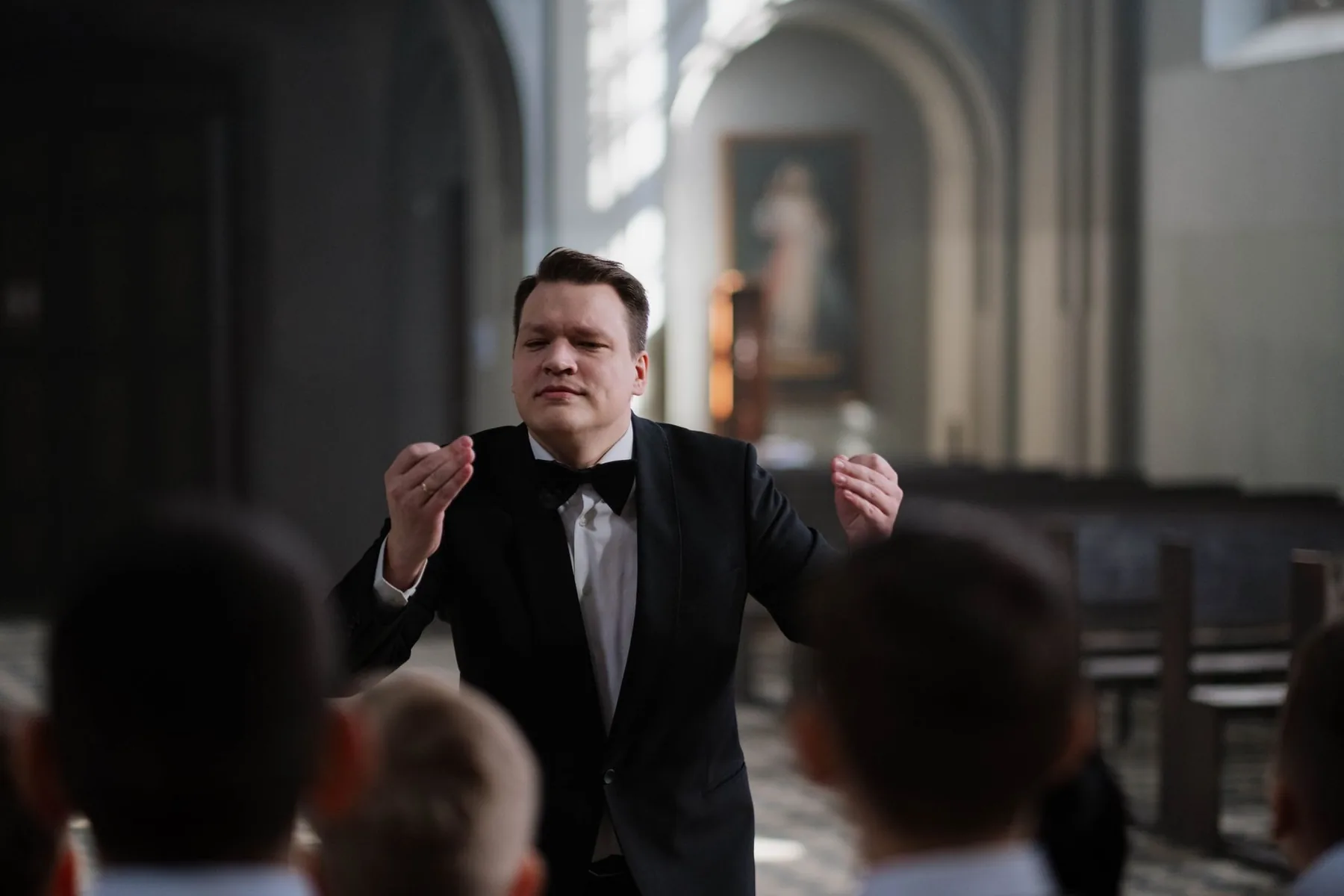 Conductor directing a choir Conductor directing a choir