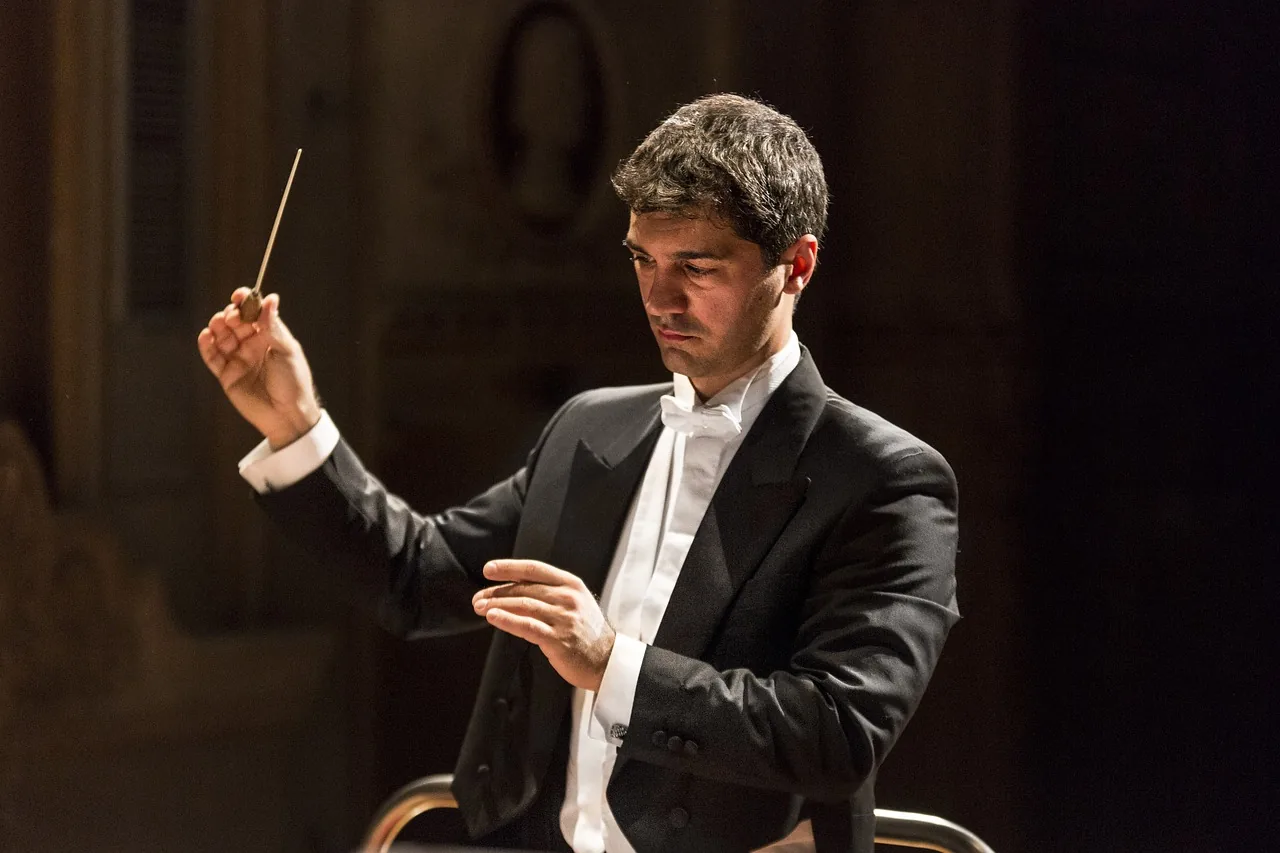 Conductor directing a classical concert Conductor directing a classical concert